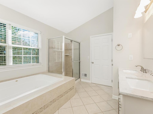 bathroom with tile patterned flooring, vanity, independent shower and bath, and lofted ceiling