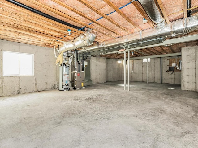 basement with heating unit and water heater