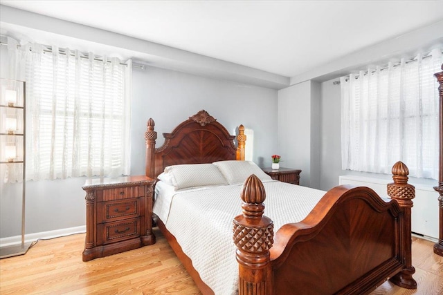 bedroom with light wood-type flooring