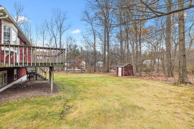 view of yard featuring a shed and a deck