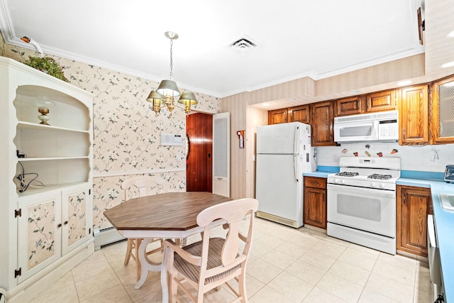 kitchen featuring white appliances, crown molding, hanging light fixtures, light tile patterned flooring, and a chandelier