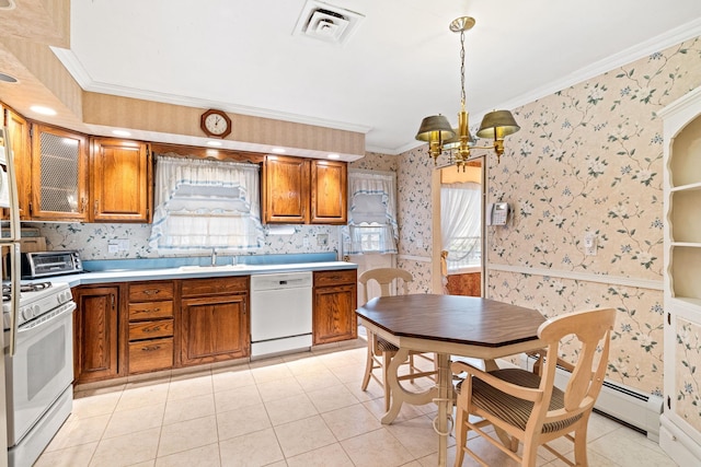 kitchen featuring light tile patterned floors, white appliances, decorative light fixtures, and crown molding