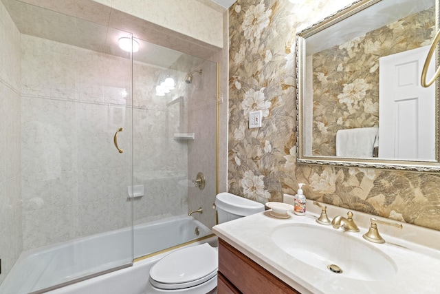 full bathroom featuring backsplash, toilet, vanity, and combined bath / shower with glass door