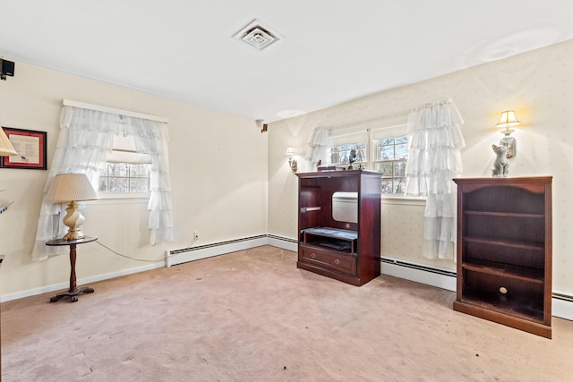 living area with baseboard heating and light carpet