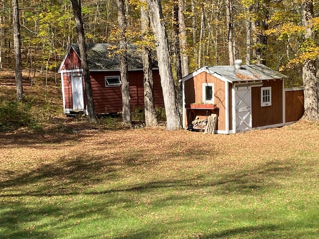 view of outbuilding with a yard