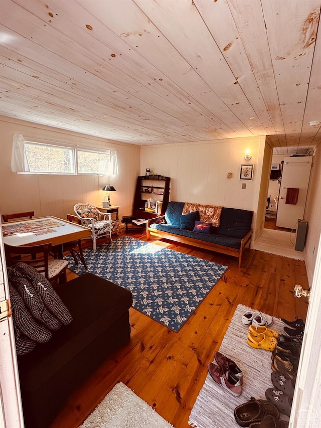 living room featuring hardwood / wood-style floors and wood ceiling