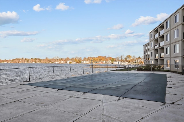 view of pool featuring a water view