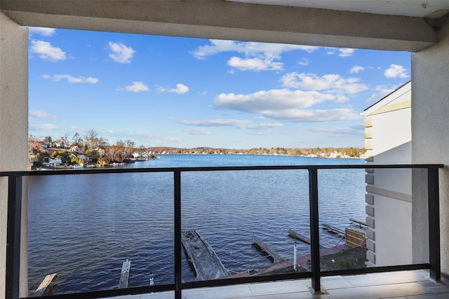 balcony featuring a water view