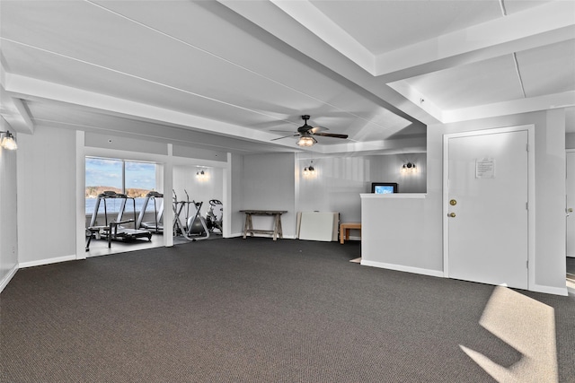 interior space with ceiling fan, beam ceiling, and carpet floors