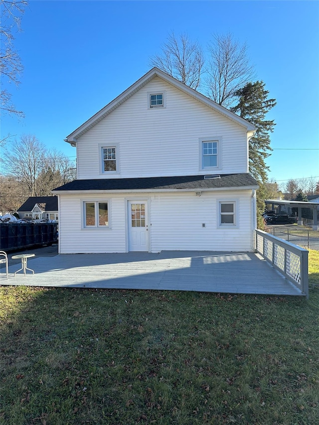 rear view of property with a lawn and a patio