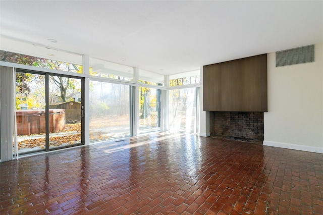 unfurnished living room featuring a healthy amount of sunlight