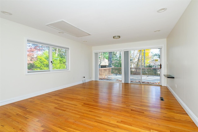 unfurnished room featuring light hardwood / wood-style floors