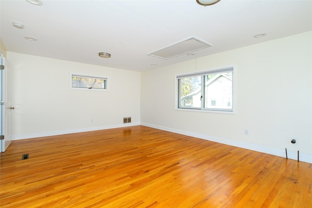 unfurnished room with light wood-type flooring