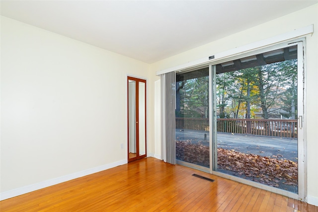 empty room featuring wood-type flooring