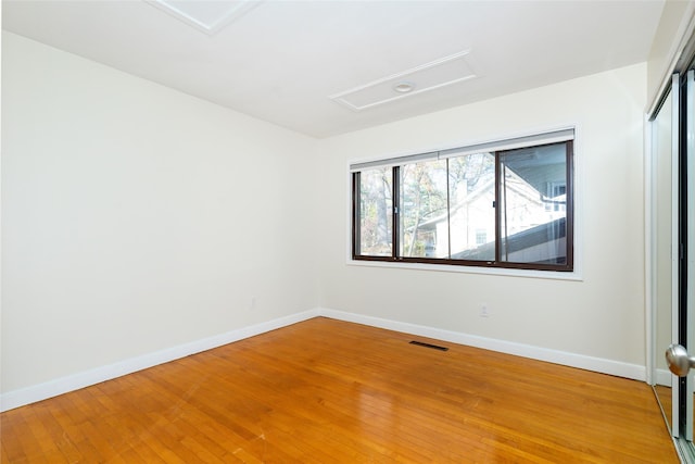 empty room featuring hardwood / wood-style floors