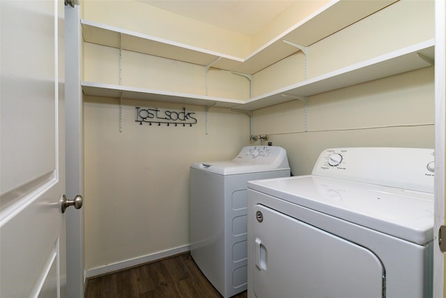 laundry room featuring dark hardwood / wood-style flooring and independent washer and dryer