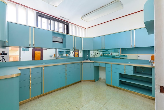 kitchen with blue cabinetry