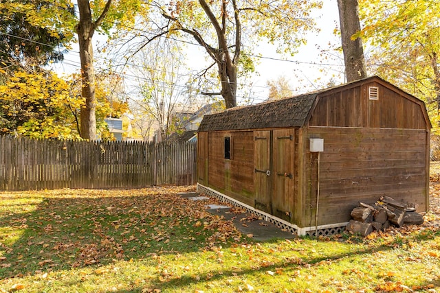 view of outdoor structure featuring a lawn