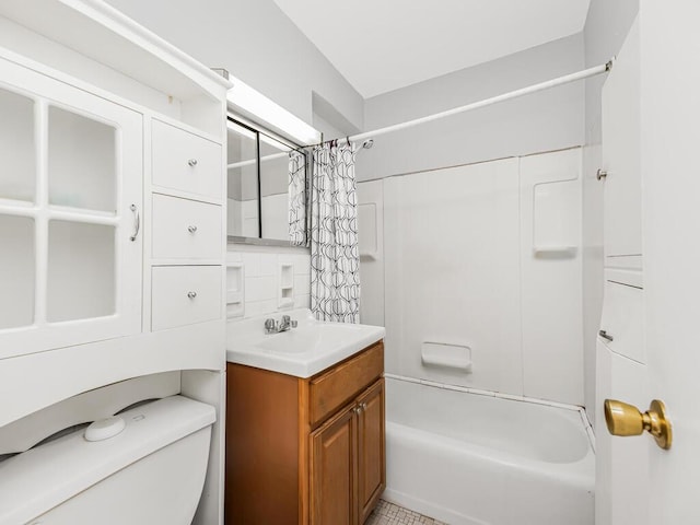 full bathroom featuring vanity, shower / bath combination with curtain, and toilet