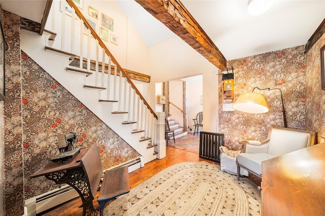 interior space with hardwood / wood-style floors and beam ceiling