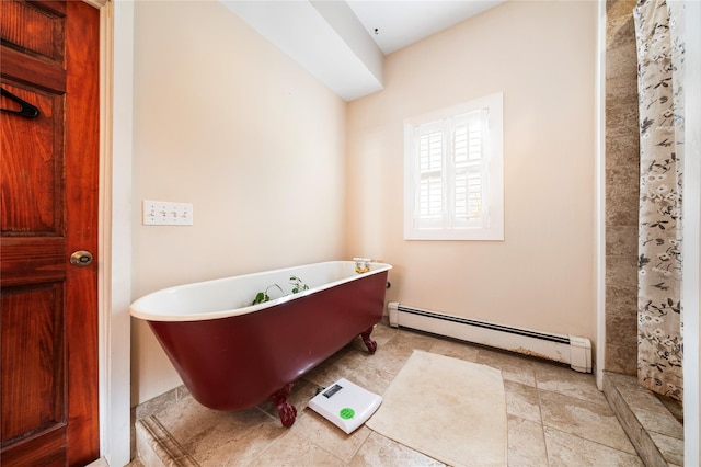 bathroom featuring baseboard heating and a tub