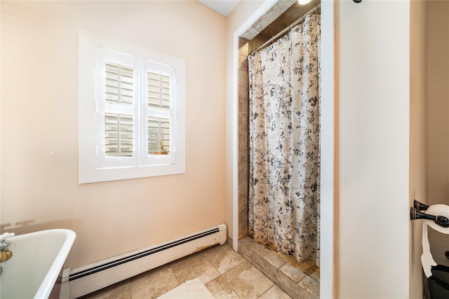 bathroom with a shower with shower curtain and a baseboard radiator