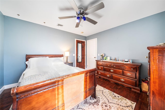 bedroom with hardwood / wood-style floors and ceiling fan