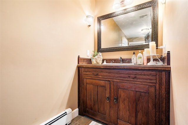 bathroom featuring vanity, a baseboard radiator, and tile patterned floors