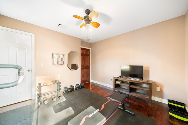 interior space featuring ceiling fan and dark hardwood / wood-style flooring