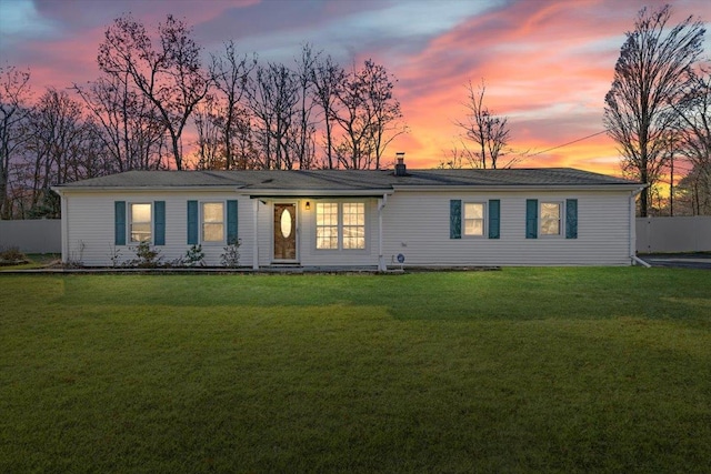 view of front of property with a lawn