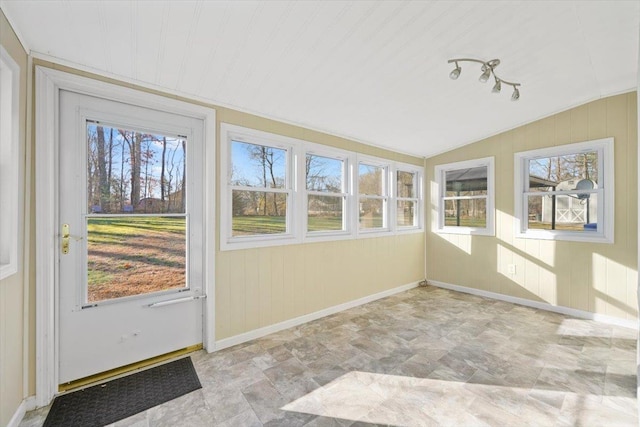 unfurnished sunroom featuring a wealth of natural light and lofted ceiling