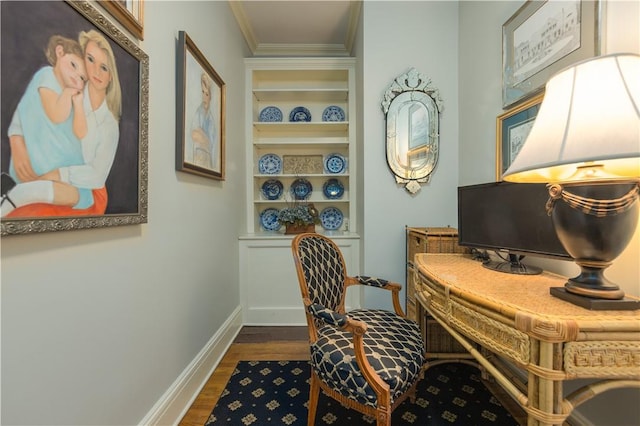 home office featuring dark hardwood / wood-style floors, built in features, and crown molding