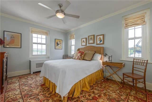 bedroom with ceiling fan, radiator heating unit, and ornamental molding