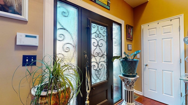 foyer featuring wood finished floors