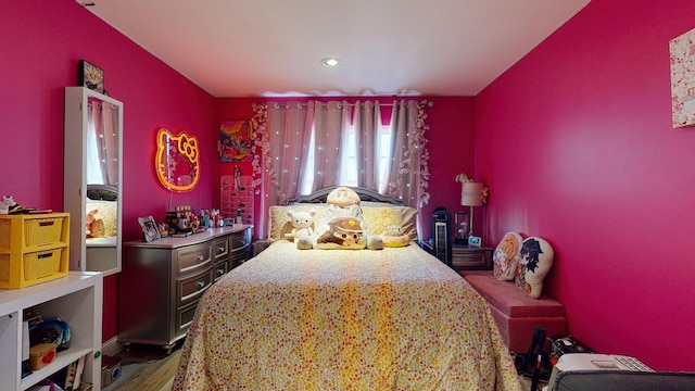 bedroom with wood finished floors