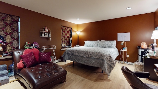 bedroom featuring recessed lighting and wood finished floors