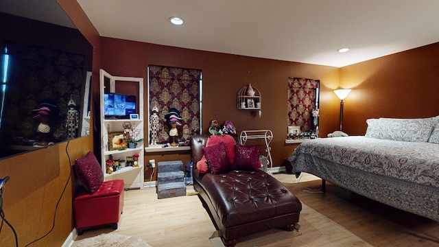 bedroom with light wood-type flooring and recessed lighting