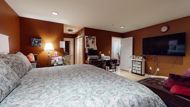 bedroom with light wood-style floors and recessed lighting