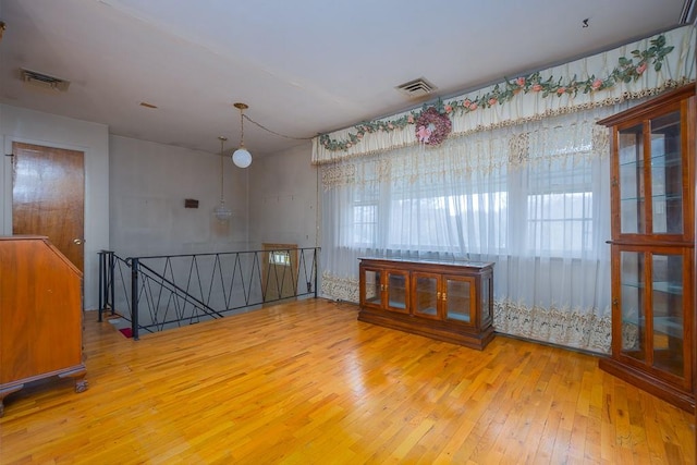 empty room with light hardwood / wood-style floors