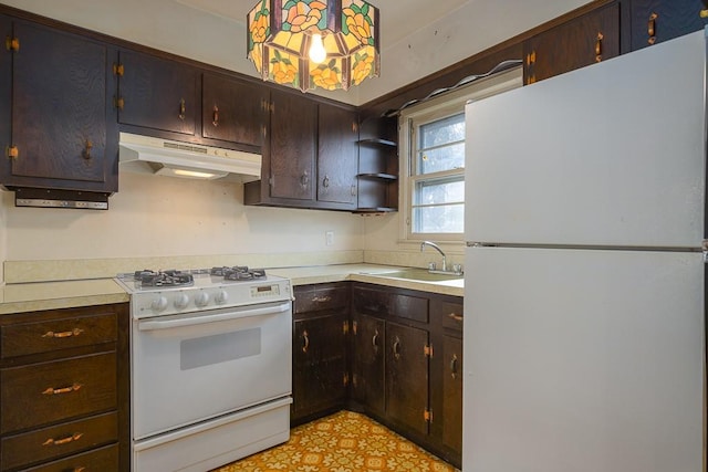 kitchen featuring dark brown cabinetry, white appliances, and sink