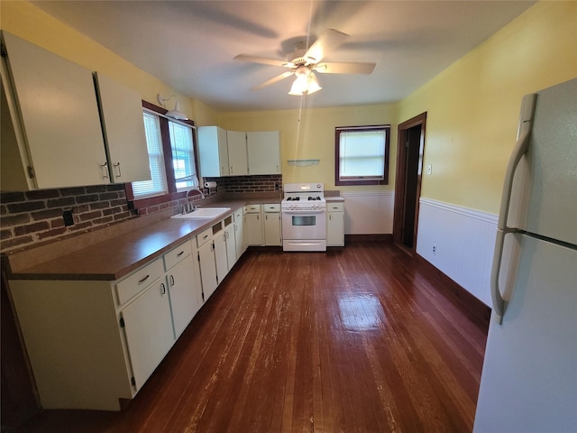 kitchen featuring white cabinets, white appliances, tasteful backsplash, and dark hardwood / wood-style floors