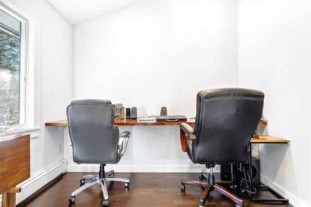 home office featuring a healthy amount of sunlight, lofted ceiling, dark wood-type flooring, and a baseboard radiator