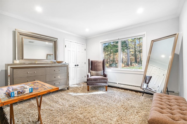 sitting room with carpet, a baseboard heating unit, and ornamental molding