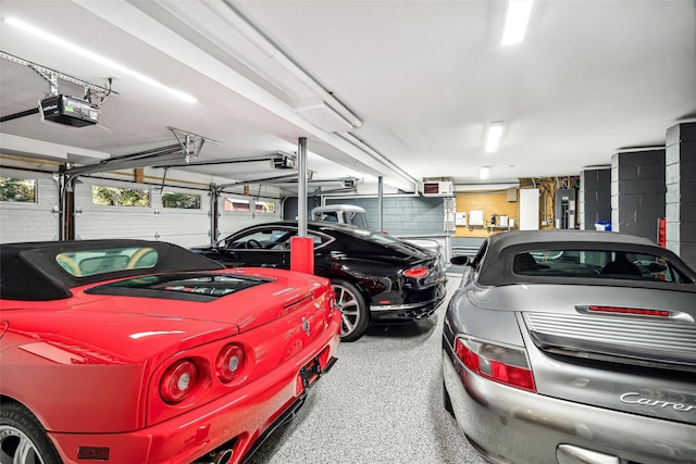 garage featuring electric panel and a garage door opener