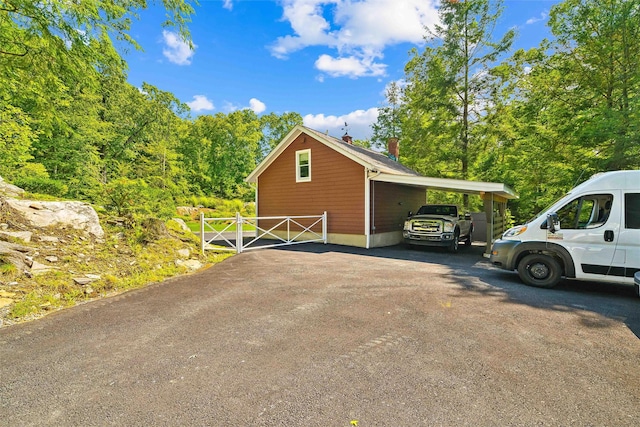 view of side of property with a carport