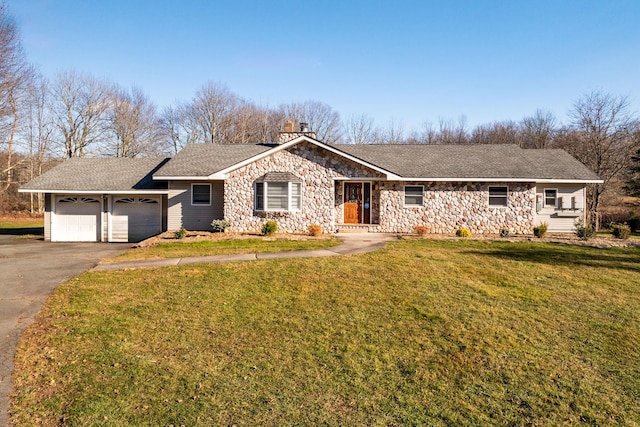 single story home featuring a front lawn and a garage