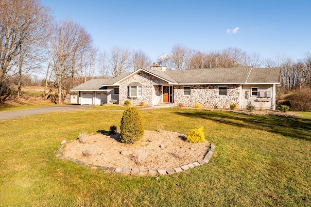 ranch-style home with a garage and a front lawn