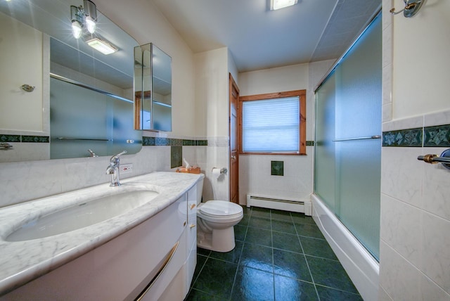 full bathroom with enclosed tub / shower combo, tile walls, and a baseboard heating unit