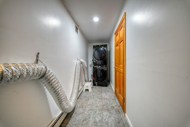 corridor with stacked washer / dryer and a baseboard radiator