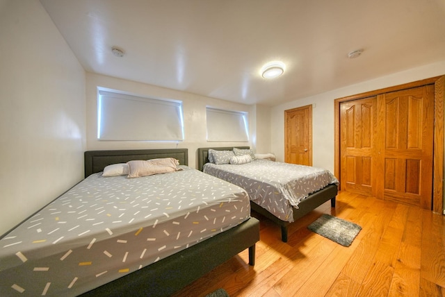 bedroom with light hardwood / wood-style floors